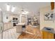 Bright kitchen with island seating, stainless steel appliances, and an open floor plan at 736 Heathrow Ave, The Villages, FL 32159
