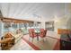 Bright lanai with tiled floors, dining set and water views at 736 Heathrow Ave, The Villages, FL 32159
