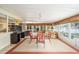 Lanai featuring tile flooring, entertainment center, and seating to maximize enjoyment of water view at 736 Heathrow Ave, The Villages, FL 32159