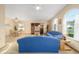 Spacious living room showcases a dining table and large windows for natural light at 736 Heathrow Ave, The Villages, FL 32159