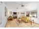 Bright living room showcasing a fireplace, tile floors, and comfortable seating at 736 Heathrow Ave, The Villages, FL 32159