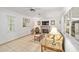 Spacious living room boasts natural light, a fireplace, and cozy furniture for a relaxed ambiance at 736 Heathrow Ave, The Villages, FL 32159