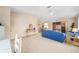 Spacious living room showcases a dining table and large windows for natural light at 736 Heathrow Ave, The Villages, FL 32159