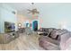 Spacious living room with hardwood floors and an entertainment center at 8161 Sun Palm Dr, Kissimmee, FL 34747