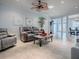 Inviting living space with tile floors, a ceiling fan, and an open view to the dining area at 9052 Se 130Th Loop, Summerfield, FL 34491