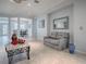 Comfortable living room with neutral decor, tile flooring, and views of the dining area at 9052 Se 130Th Loop, Summerfield, FL 34491