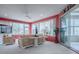 This spacious living room is bright and open with a sliding glass doors to the outside at 9052 Se 130Th Loop, Summerfield, FL 34491