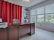 Functional home office providing plenty of natural light and a pleasant golf course view at 9052 Se 130Th Loop, Summerfield, FL 34491