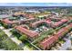 Aerial view of a residential community with multiple buildings, parking, and lush landscaping at 907 Charo Pkwy # 915, Davenport, FL 33897