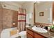 Well-appointed bathroom featuring a vanity with granite countertops and a shower-tub combo at 907 Charo Pkwy # 915, Davenport, FL 33897
