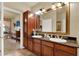 Spacious bathroom with double sinks, plenty of counter space, and vanity storage at 907 Charo Pkwy # 915, Davenport, FL 33897