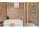 Comfortable bathroom with a tub and shower, tiled walls, and a small window for natural light at 907 Charo Pkwy # 915, Davenport, FL 33897