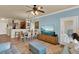 Living room with blue walls, view of dining area and kitchen, leading to an open-concept living at 907 Charo Pkwy # 915, Davenport, FL 33897