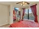 Inviting bedroom with a large window, mirrored closet, and TV for entertainment at 907 Charo Pkwy # 915, Davenport, FL 33897