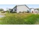 Expansive backyard with lush lawn and landscaping, offering a private outdoor space at 9312 Se 172Nd Wayside Pl, The Villages, FL 32162