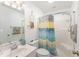 Bright bathroom featuring a shower/tub combo with a stylish, colorful shower curtain and modern fixtures at 9312 Se 172Nd Wayside Pl, The Villages, FL 32162