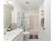 Bright bathroom featuring a shower/tub combo with a decorative shower curtain and a white vanity at 9312 Se 172Nd Wayside Pl, The Villages, FL 32162