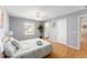 Spacious bedroom featuring a ceiling fan, a window, and hardwood flooring at 9312 Se 172Nd Wayside Pl, The Villages, FL 32162