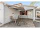 Relaxing front porch with brick pavers, retractable awning, and two chairs at 9312 Se 172Nd Wayside Pl, The Villages, FL 32162