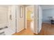 View from the hallway into a bright bedroom and bath, showcasing the floor plan and flow of the home at 9312 Se 172Nd Wayside Pl, The Villages, FL 32162