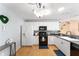 Well-lit kitchen with stainless steel appliances, and hardwood flooring at 9312 Se 172Nd Wayside Pl, The Villages, FL 32162