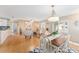 Open concept living space with dining table and living area with lots of space at 9312 Se 172Nd Wayside Pl, The Villages, FL 32162