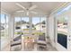 Relaxing sunroom with comfortable seating and large windows offering a great view at 9312 Se 172Nd Wayside Pl, The Villages, FL 32162