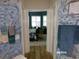 Bathroom has view into an adjoining bedroom at 10173 Julia Isles Ave, Oxford, FL 34484