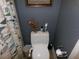 Cozy powder room showcasing fish themed decor at 10173 Julia Isles Ave, Oxford, FL 34484
