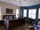 This bedroom has natural light and a sitting area at 10173 Julia Isles Ave, Oxford, FL 34484