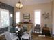 Dining room with bright lighting and four chairs at 10173 Julia Isles Ave, Oxford, FL 34484