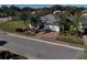 Single-story home with palm trees, brick driveway, and manicured landscaping offers great curb appeal at 10173 Julia Isles Ave, Oxford, FL 34484