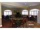 Community game room with multiple game tables, comfortable seating, and ample space for entertainment at 10173 Julia Isles Ave, Oxford, FL 34484
