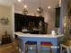 Modern kitchen with stainless steel appliances, sleek countertops, and stylish pendant lighting at 10173 Julia Isles Ave, Oxford, FL 34484