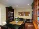 Spacious library equipped with bookshelves, a work station, and a large table for reading or meetings at 10173 Julia Isles Ave, Oxford, FL 34484