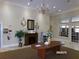 The community lobby features elegant decor, comfortable seating, and a fireplace for a welcoming ambiance at 10173 Julia Isles Ave, Oxford, FL 34484