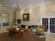 View of the lobby area with neutral walls, stylish furniture and patterned carpet at 10173 Julia Isles Ave, Oxford, FL 34484