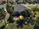 Lush landscaping enhances the outdoor living space, perfect for relaxing near the pond at 10173 Julia Isles Ave, Oxford, FL 34484
