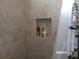 Shower niche with decorative toiletries at 10173 Julia Isles Ave, Oxford, FL 34484