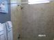 Tiled shower with chrome fixtures at 10173 Julia Isles Ave, Oxford, FL 34484