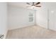 Bedroom featuring carpet, a ceiling fan, and a single window at 10396 Silver Maple Ave, Oxford, FL 34484