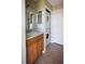 Bathroom featuring a sink and stacked washer and dryer at 10648 Lake Hill Dr, Clermont, FL 34711