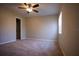Bedroom with wall-to-wall carpet, ceiling fan, and natural lighting at 10648 Lake Hill Dr, Clermont, FL 34711