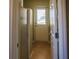 Narrow laundry room featuring a stand-up shower and back door at 10648 Lake Hill Dr, Clermont, FL 34711