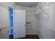 Walk-in closet with white wire shelving and hanging racks for optimal storage at 10648 Lake Hill Dr, Clermont, FL 34711