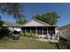 This yard includes a screened lanai and fire pit area at 10910 Rushwood Way, Clermont, FL 34714