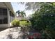 Backyard featuring lush landscaping, a fire pit area, and a privacy fence at 10910 Rushwood Way, Clermont, FL 34714