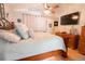 Bedroom featuring a comfortable bed and a large TV at 10910 Rushwood Way, Clermont, FL 34714