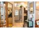 Inviting entryway showcasing views of the kitchen and living areas, plus stylish decor at 10910 Rushwood Way, Clermont, FL 34714