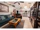 Comfortable living room showcasing an open floor plan, vaulted ceilings, and plenty of decor at 10910 Rushwood Way, Clermont, FL 34714